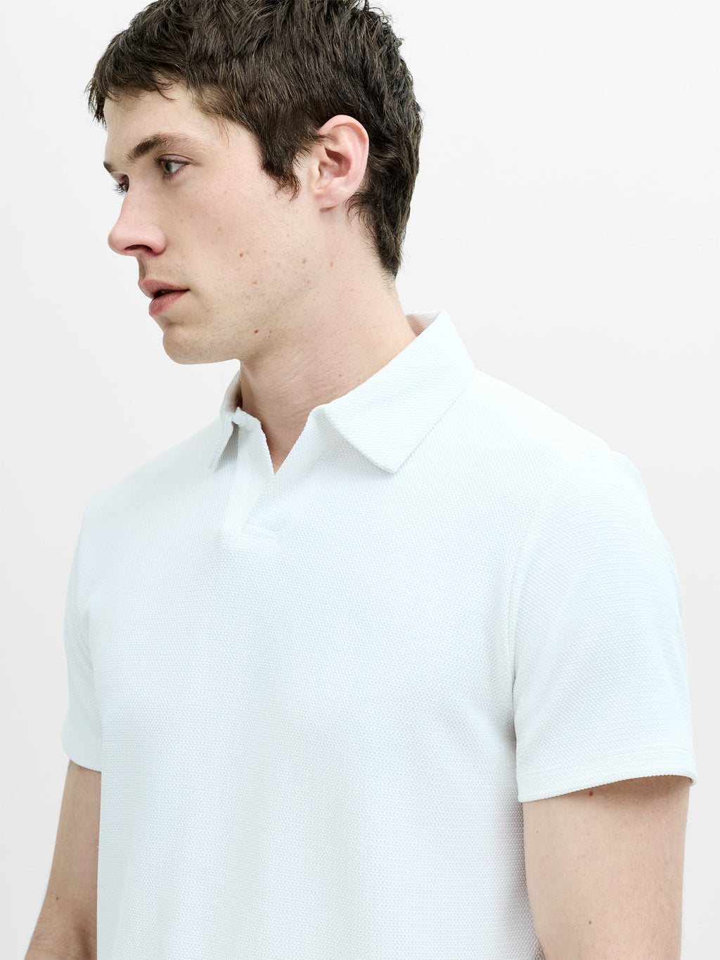 Polo blanc en maille ajourée à manches courtes