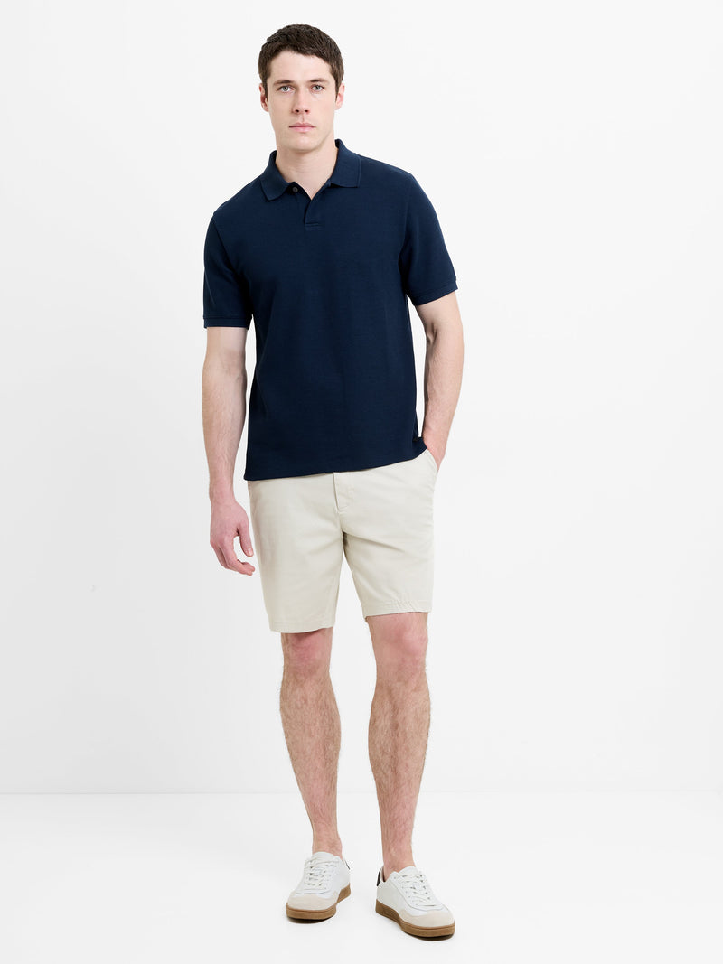 Polo à manches courtes marine avec patte de boutonnage dissimulée