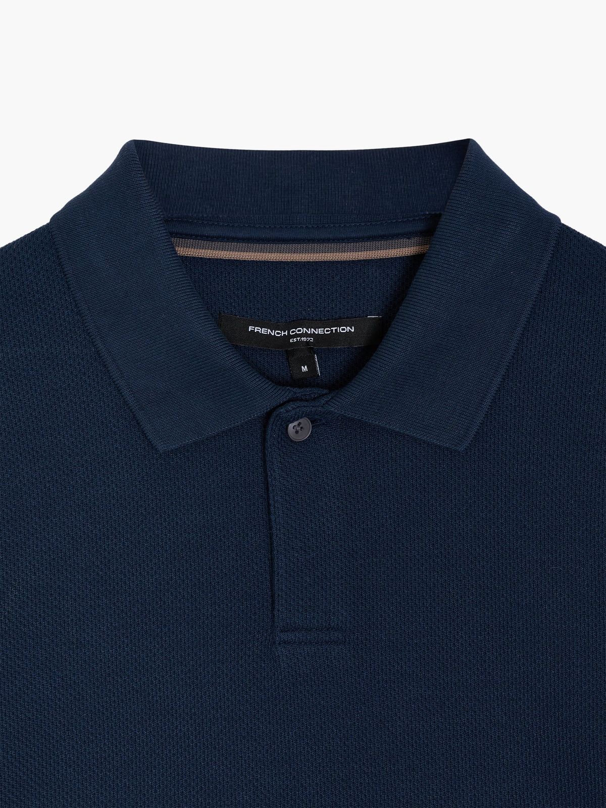Polo à manches courtes marine avec patte de boutonnage dissimulée